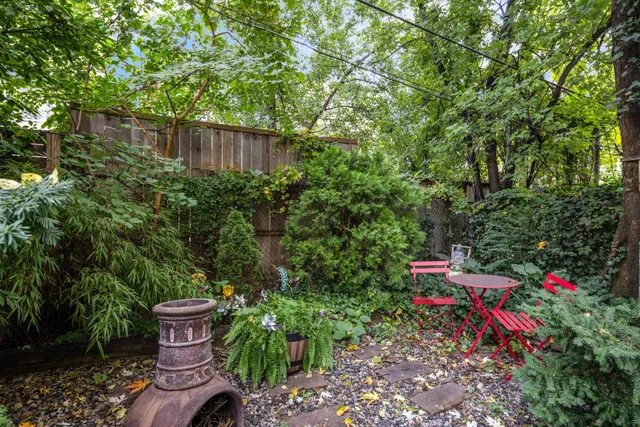 a backyard of a house with outdoor seating