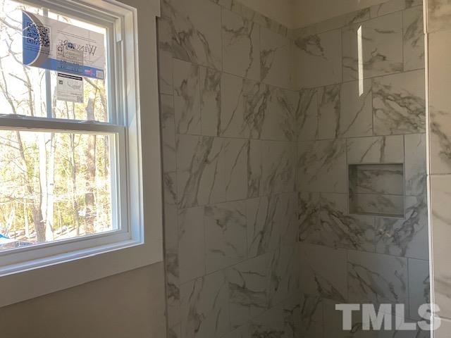1133 Benning Street Durham, NC 27704 - Photo 11 of 22 a bathroom with a window