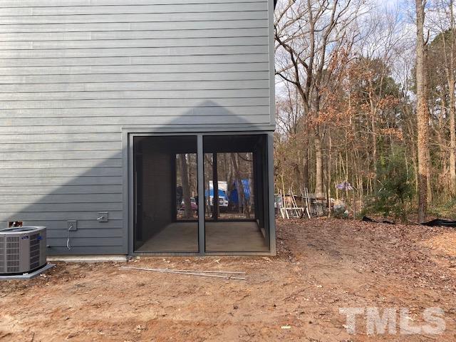 1133 Benning Street Durham, NC 27704 - Photo 20 of 22 a view of a house with backyard porch and wooden fence