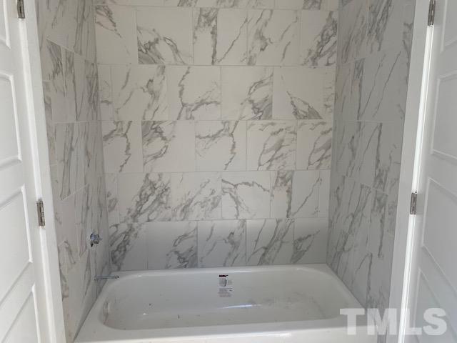 1133 Benning Street Durham, NC 27704 - Photo 10 of 22 a bathroom with a bathtub