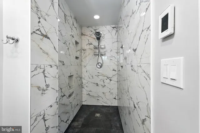 a bathroom with a sink toilet and mirror