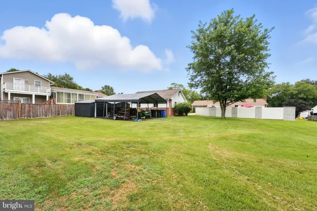a view of a room with wooden walls