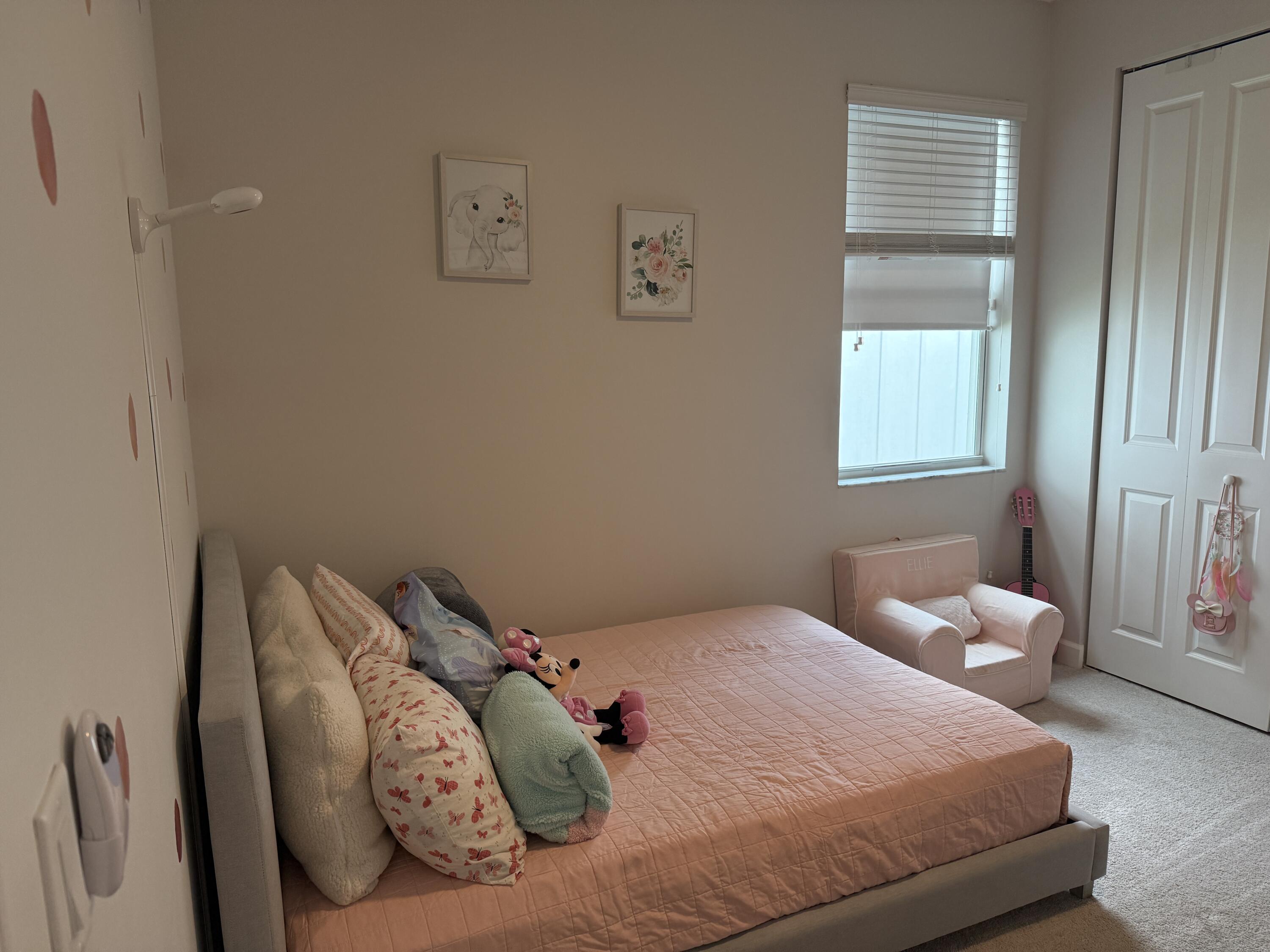 1382 Arrowhead Point Road Loxahatchee, FL 33470 - Photo 12 of 55 a bedroom with a bed and window