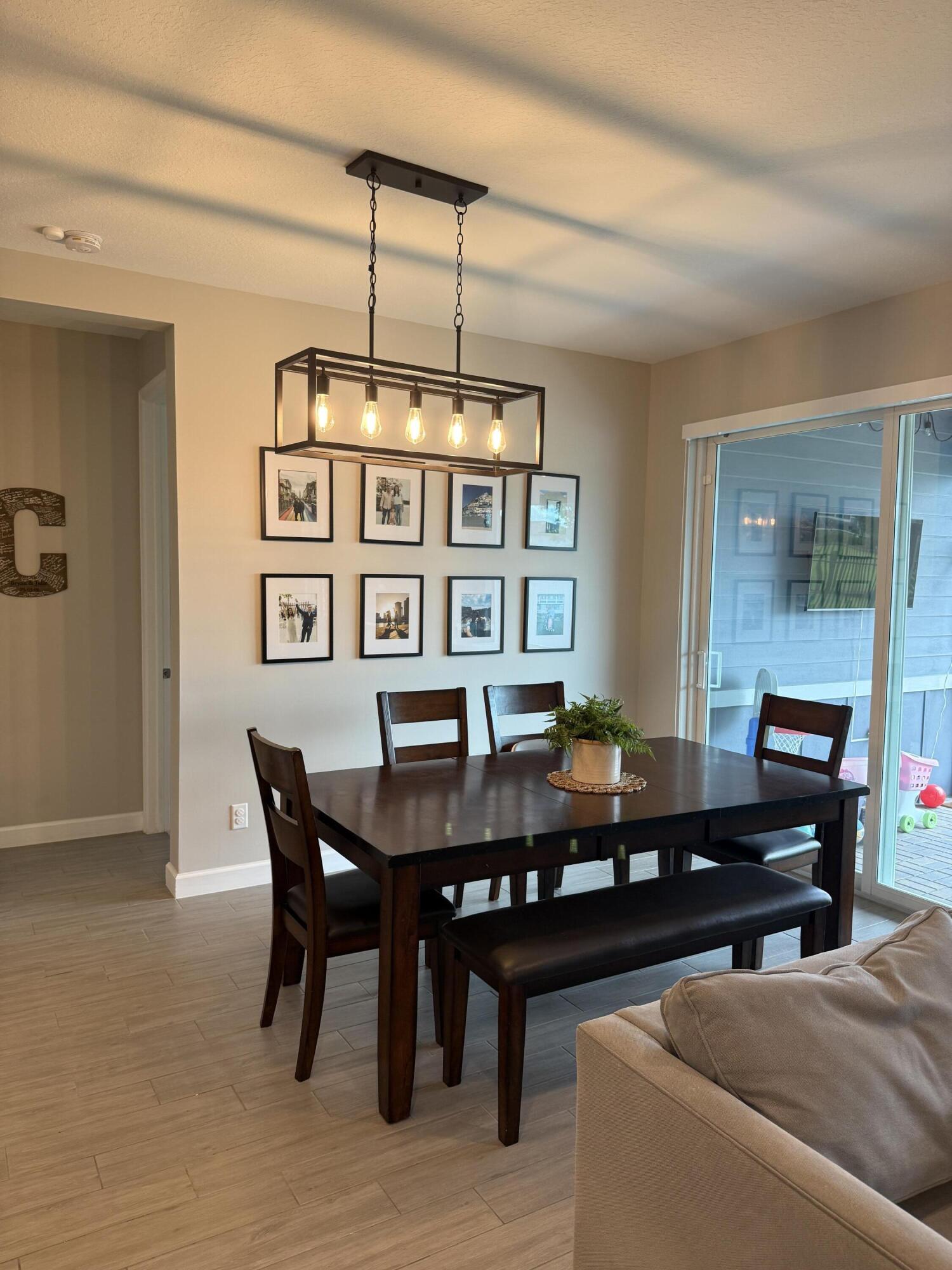 1382 Arrowhead Point Road Loxahatchee, FL 33470 - Photo 20 of 55 a view of a dining room with furniture