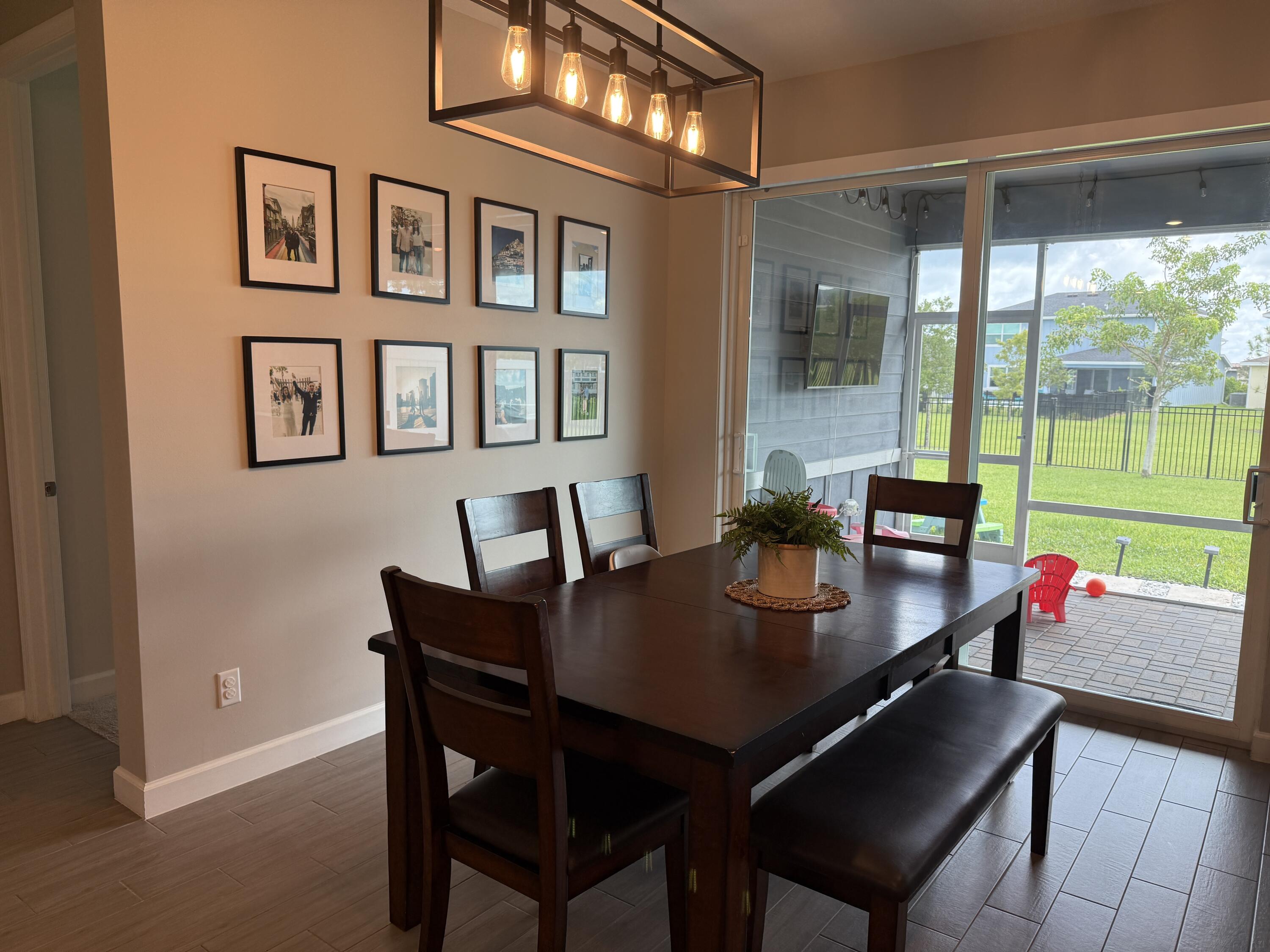 1382 Arrowhead Point Road Loxahatchee, FL 33470 - Photo 21 of 55 a view of a dining room with furniture window and outside view