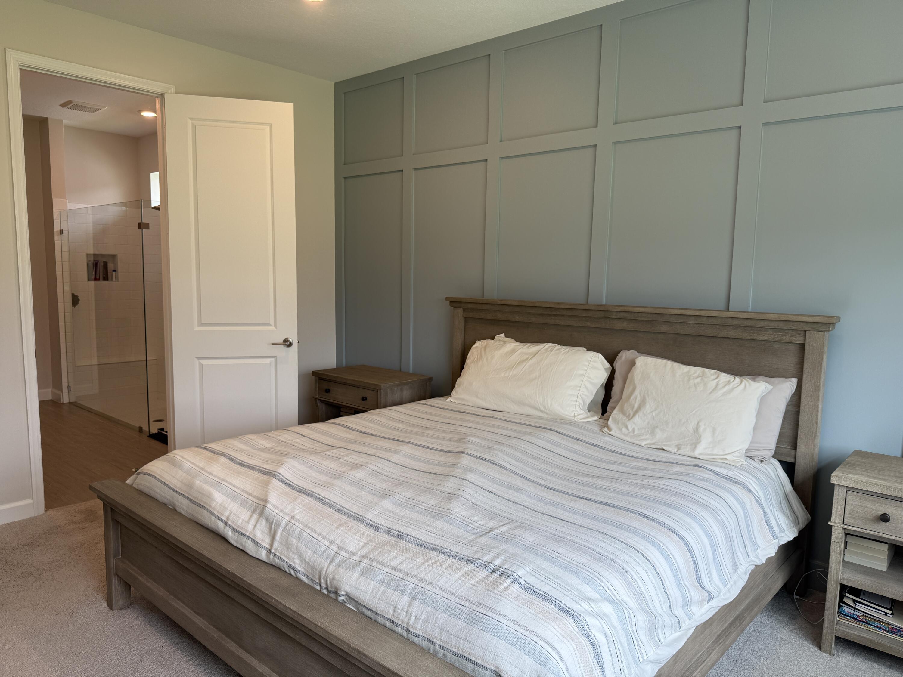 1382 Arrowhead Point Road Loxahatchee, FL 33470 - Photo 30 of 55 a bedroom with a bed and a shower