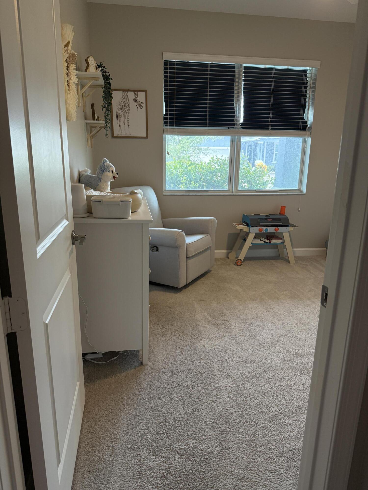 1382 Arrowhead Point Road Loxahatchee, FL 33470 - Photo 4 of 55 a room with furniture and a window