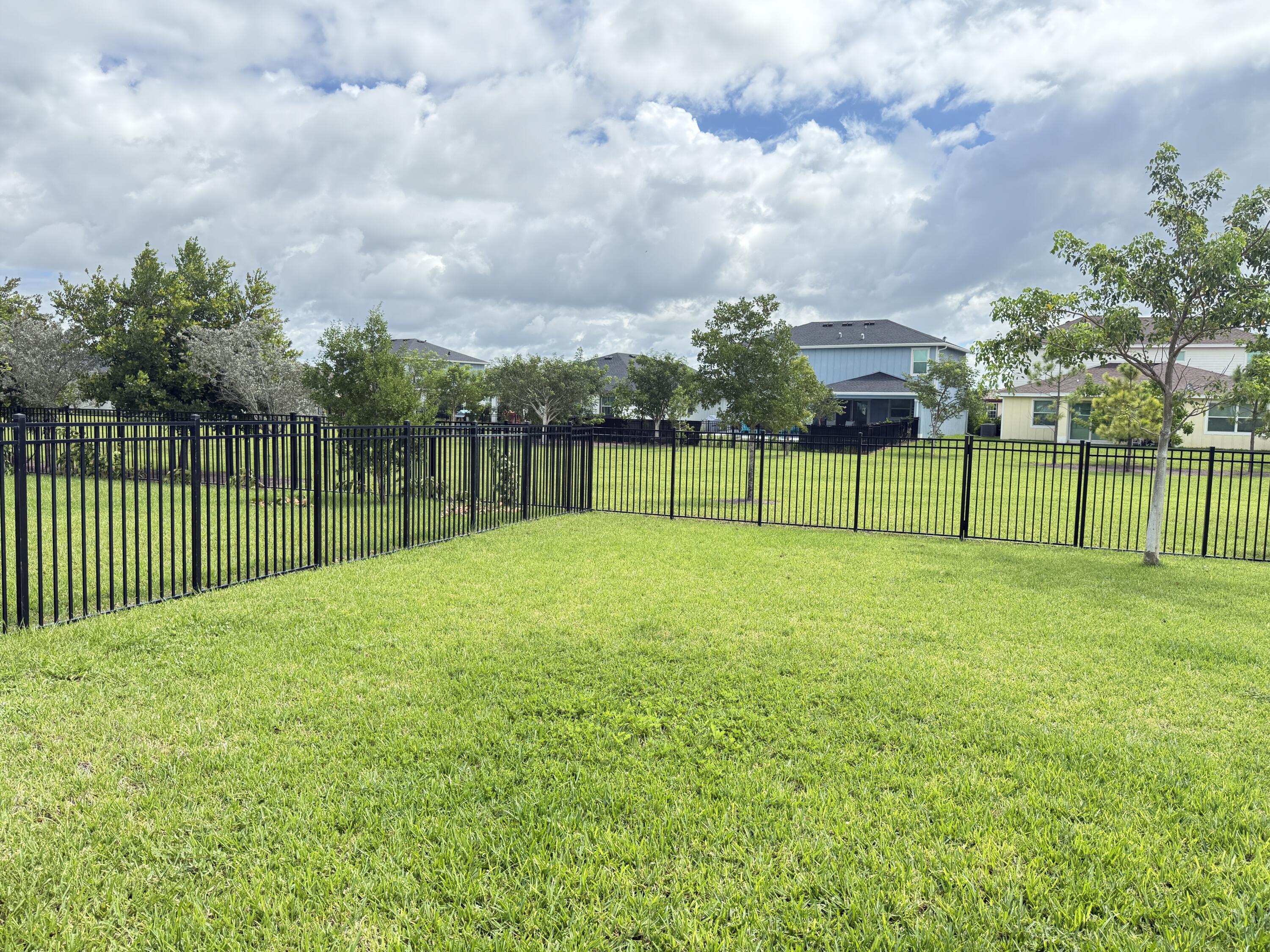 1382 Arrowhead Point Road Loxahatchee, FL 33470 - Photo 41 of 55 a view of a yard with a big and trees