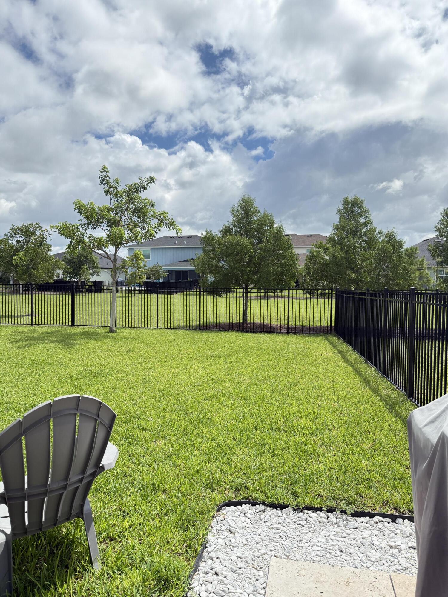 1382 Arrowhead Point Road Loxahatchee, FL 33470 - Photo 43 of 55 a view of a golf course with a garden