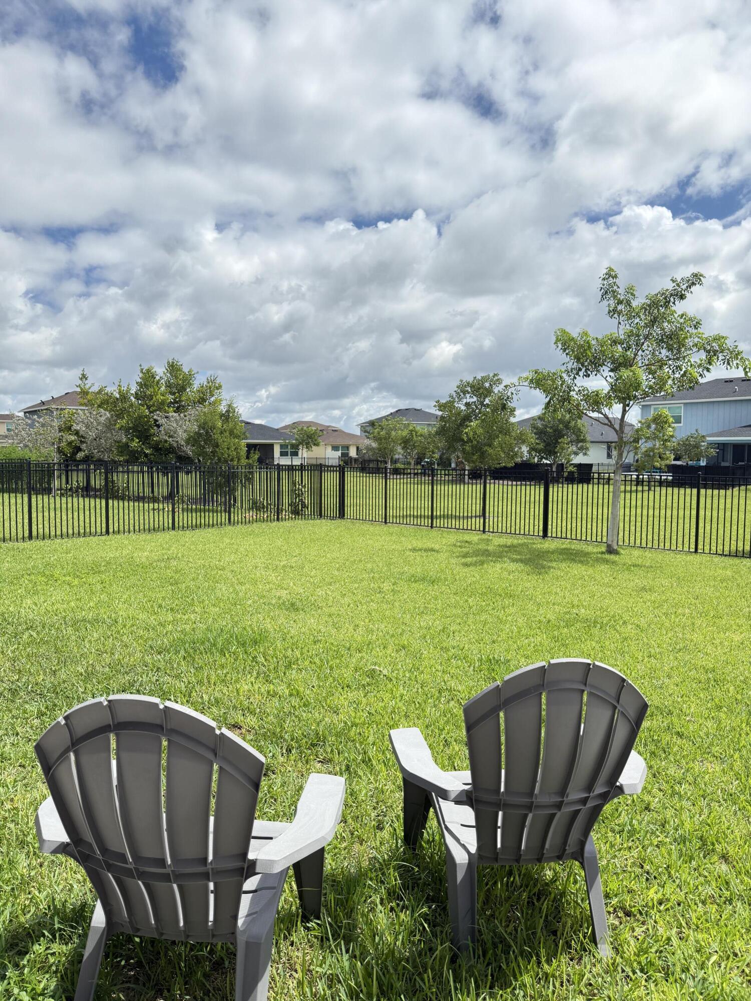 1382 Arrowhead Point Road Loxahatchee, FL 33470 - Photo 44 of 55 a view of a golf course with a garden