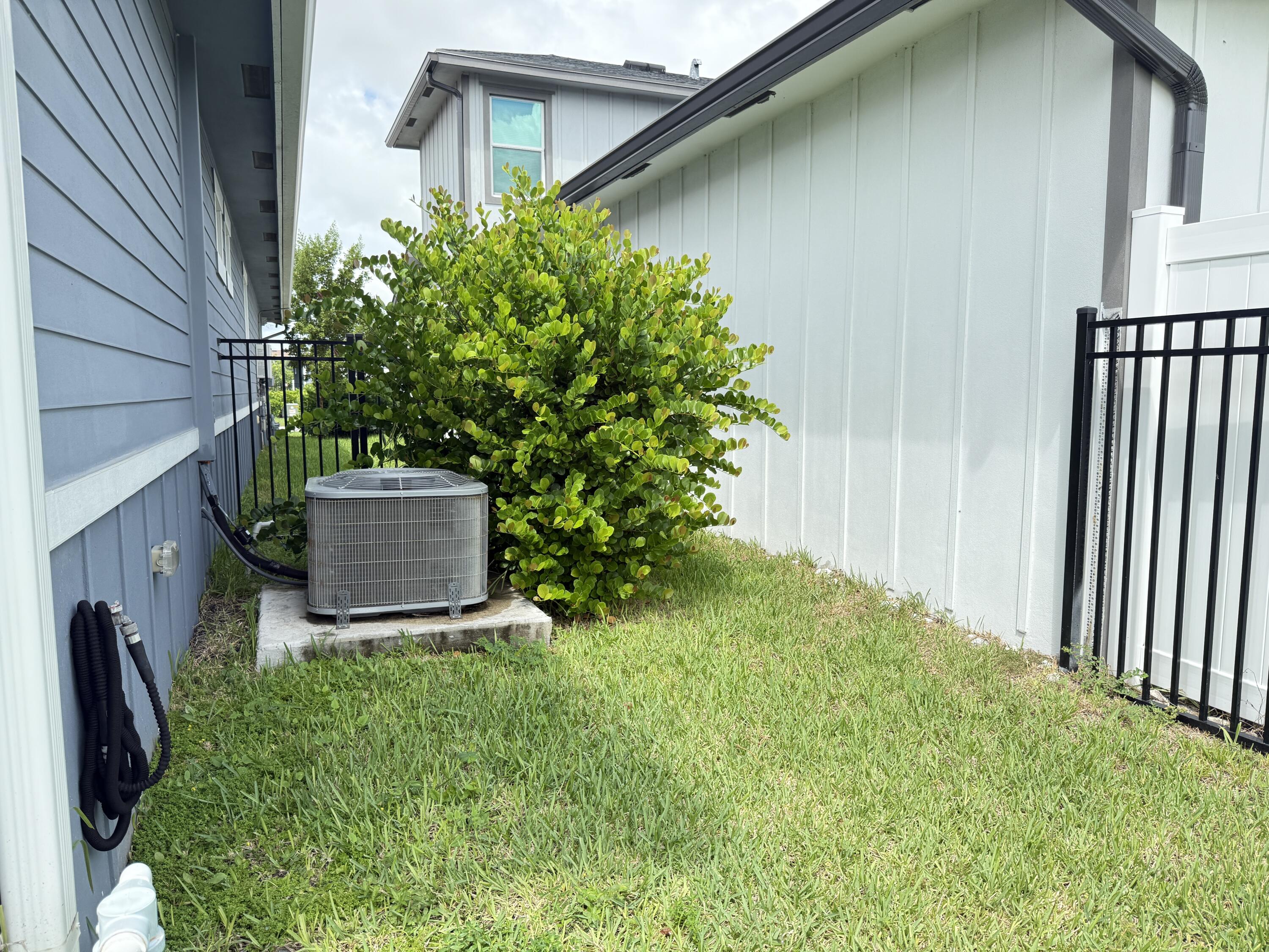 1382 Arrowhead Point Road Loxahatchee, FL 33470 - Photo 45 of 55 a backyard of a house with lots of green space