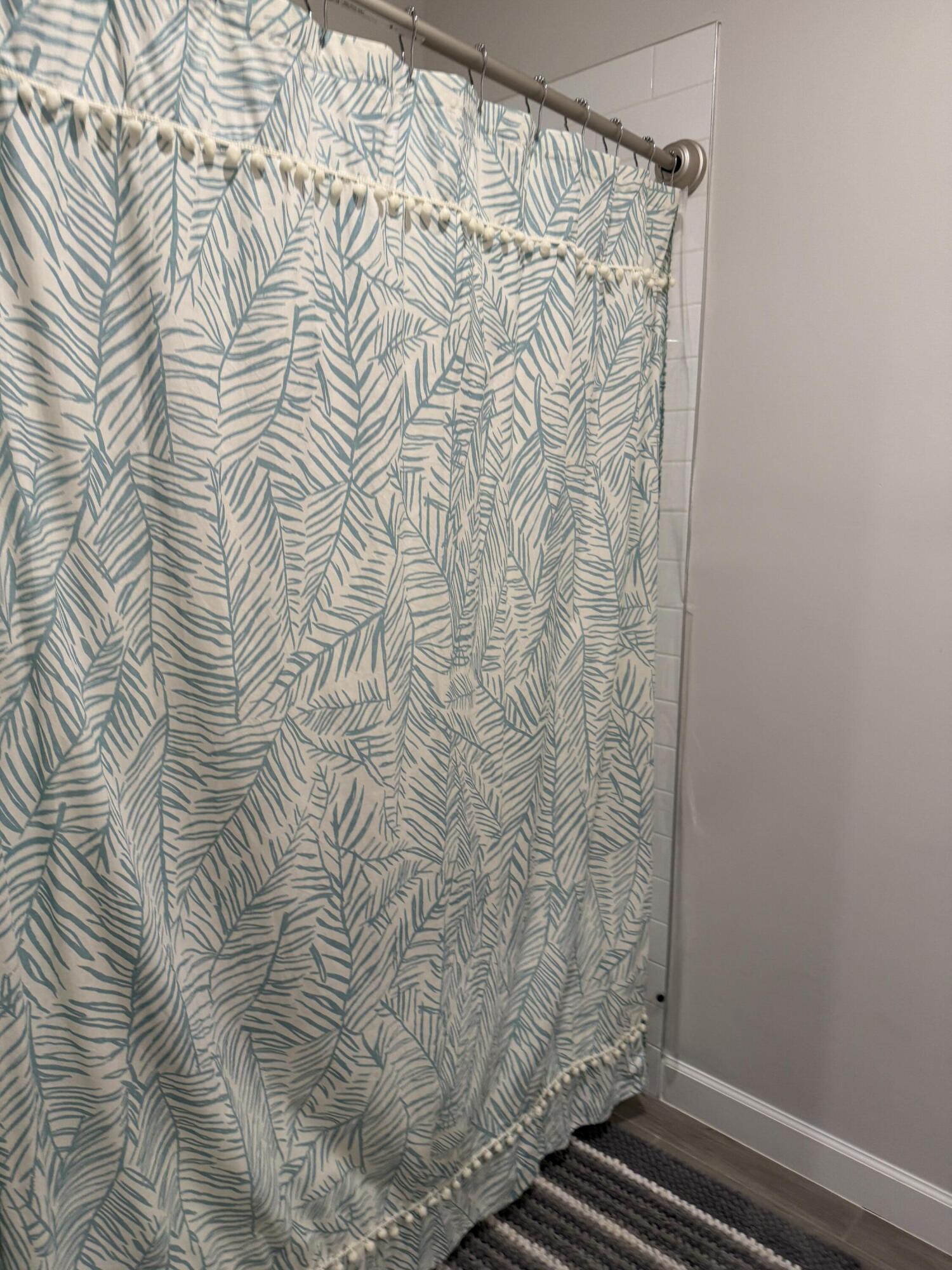 1382 Arrowhead Point Road Loxahatchee, FL 33470 - Photo 9 of 55 a bathroom with a shower curtain