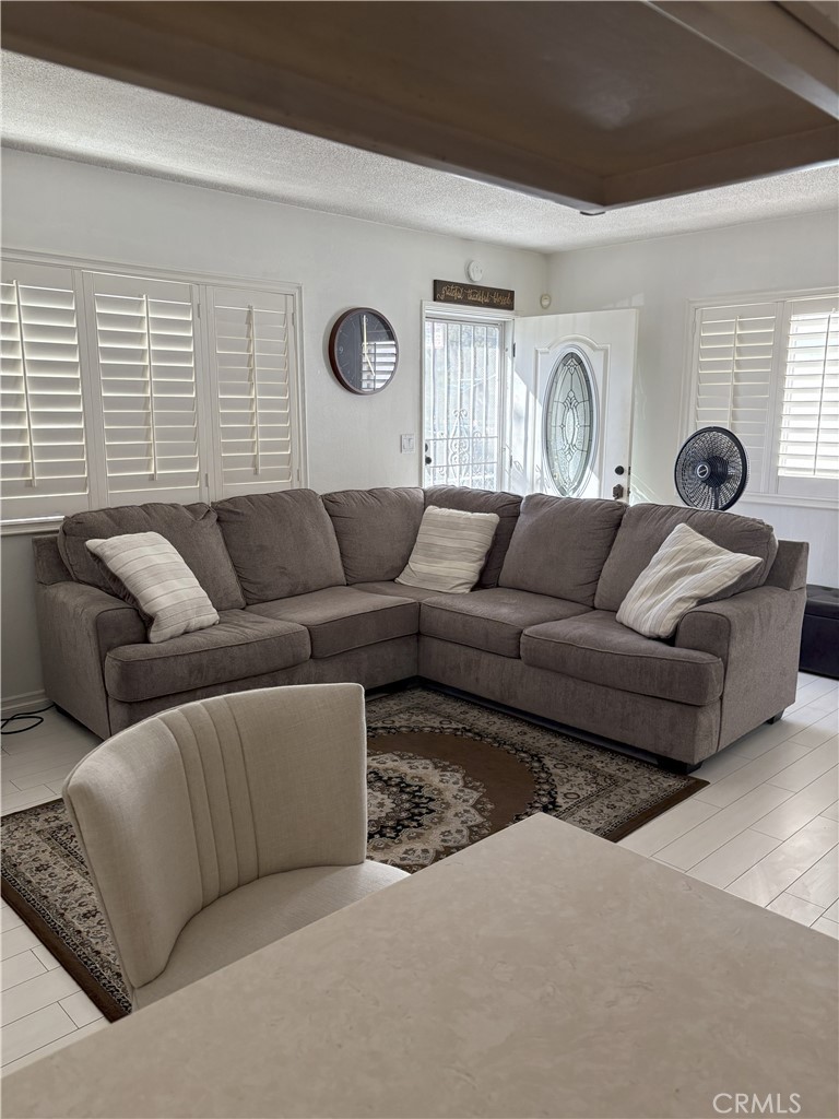 2206 Cowlin Avenue Commerce, CA 90040 - Photo 3 of 8 a living room with furniture and a window