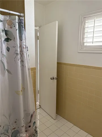 a bathroom with a shower and a sink