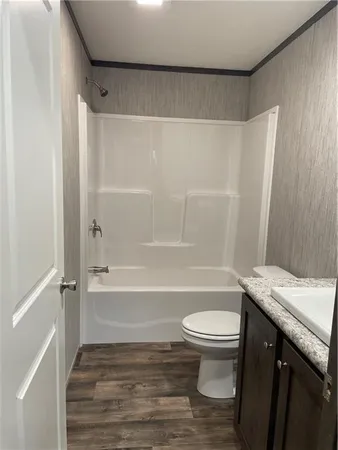a bathroom with a sink a toilet and a bathtub