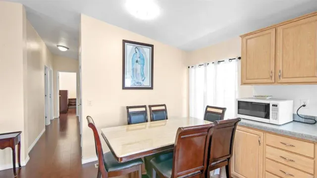 a dining room with furniture and window
