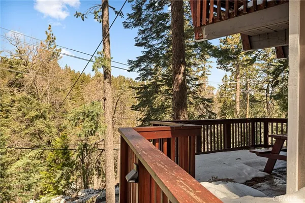 a view of a wooden bench in a balcony