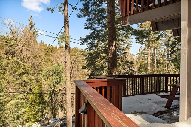 a view of a wooden bench in a balcony