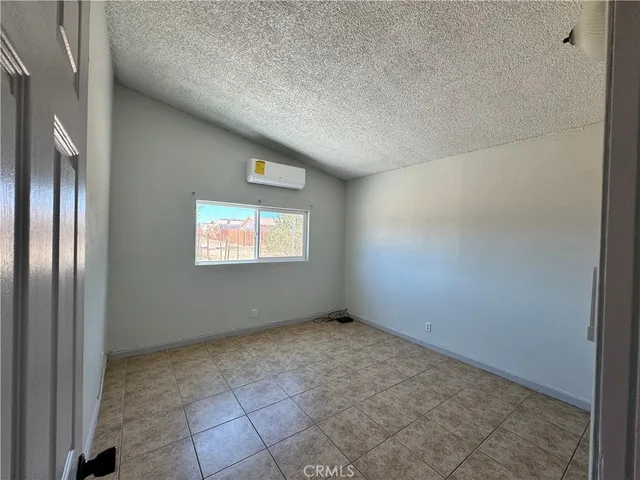 an empty room with a bathroom