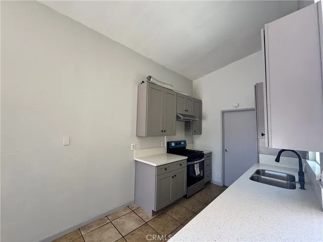 a view of a hallway with a bathroom