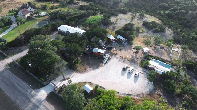 an aerial view of a house with a yard