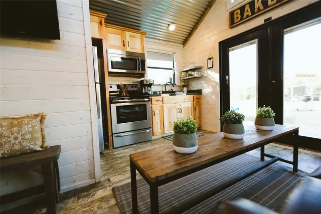 a kitchen with a sink appliances and cabinets