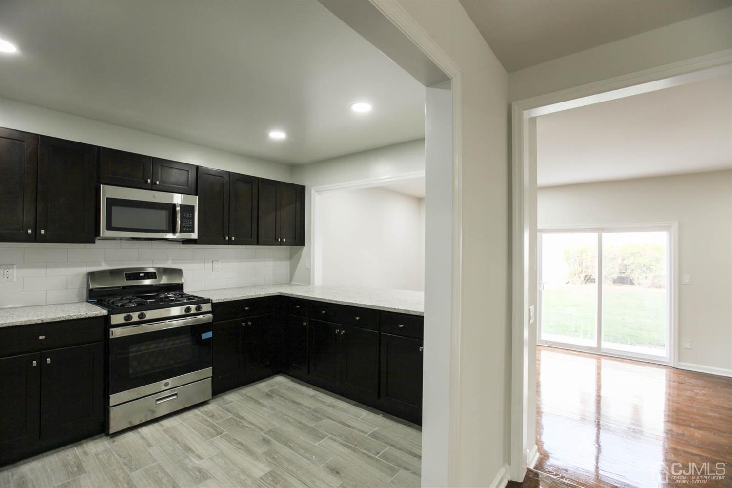 3704 Hana Road Edison, NJ 08817 - Photo 3 of 15 a kitchen with a sink and steel appliances