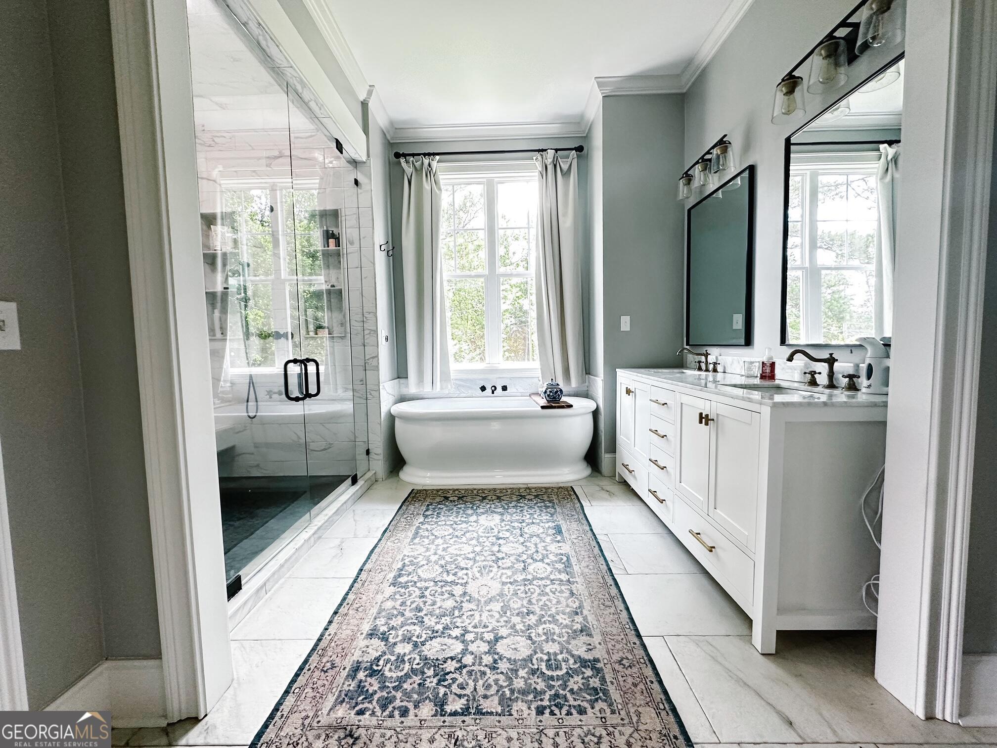 7093 Vaughn Road Woodstock, GA 30188 - Photo 15 of 41 a bathroom with a double vanity sink and mirror