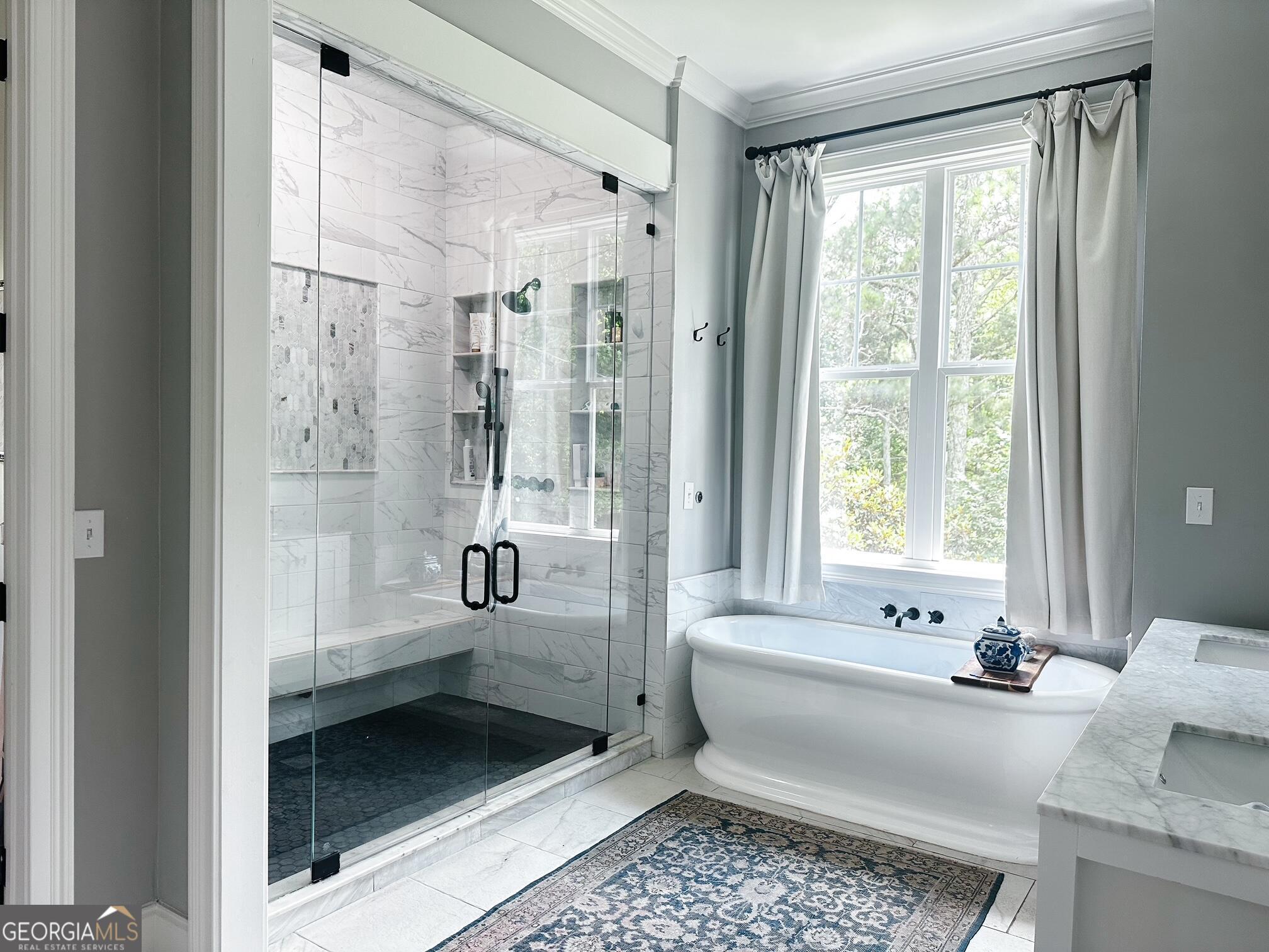 7093 Vaughn Road Woodstock, GA 30188 - Photo 16 of 41 a bathroom with a tub shower and sink
