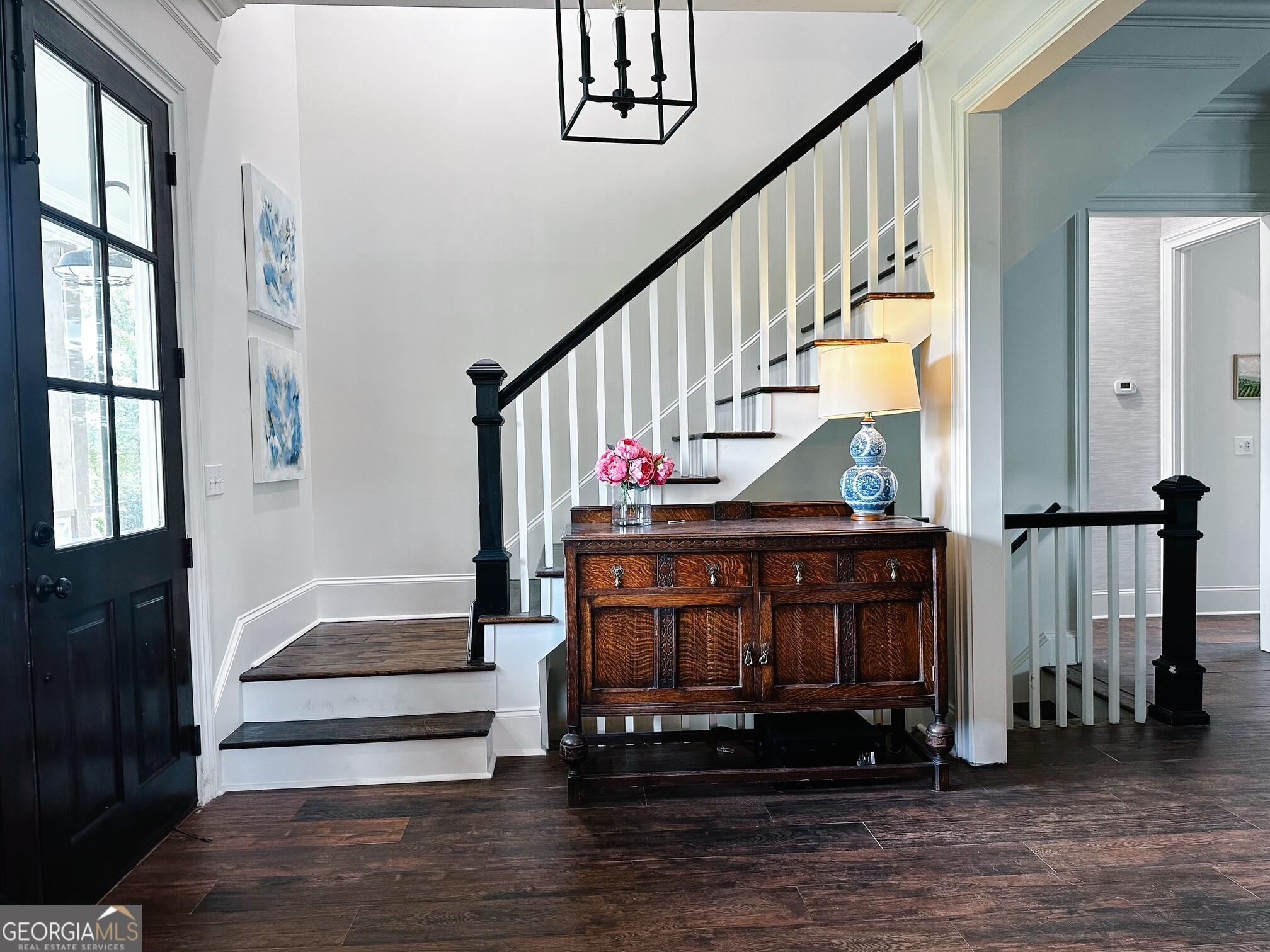7093 Vaughn Road Woodstock, GA 30188 - Photo 19 of 41 a view of entryway with wooden floor and a front door
