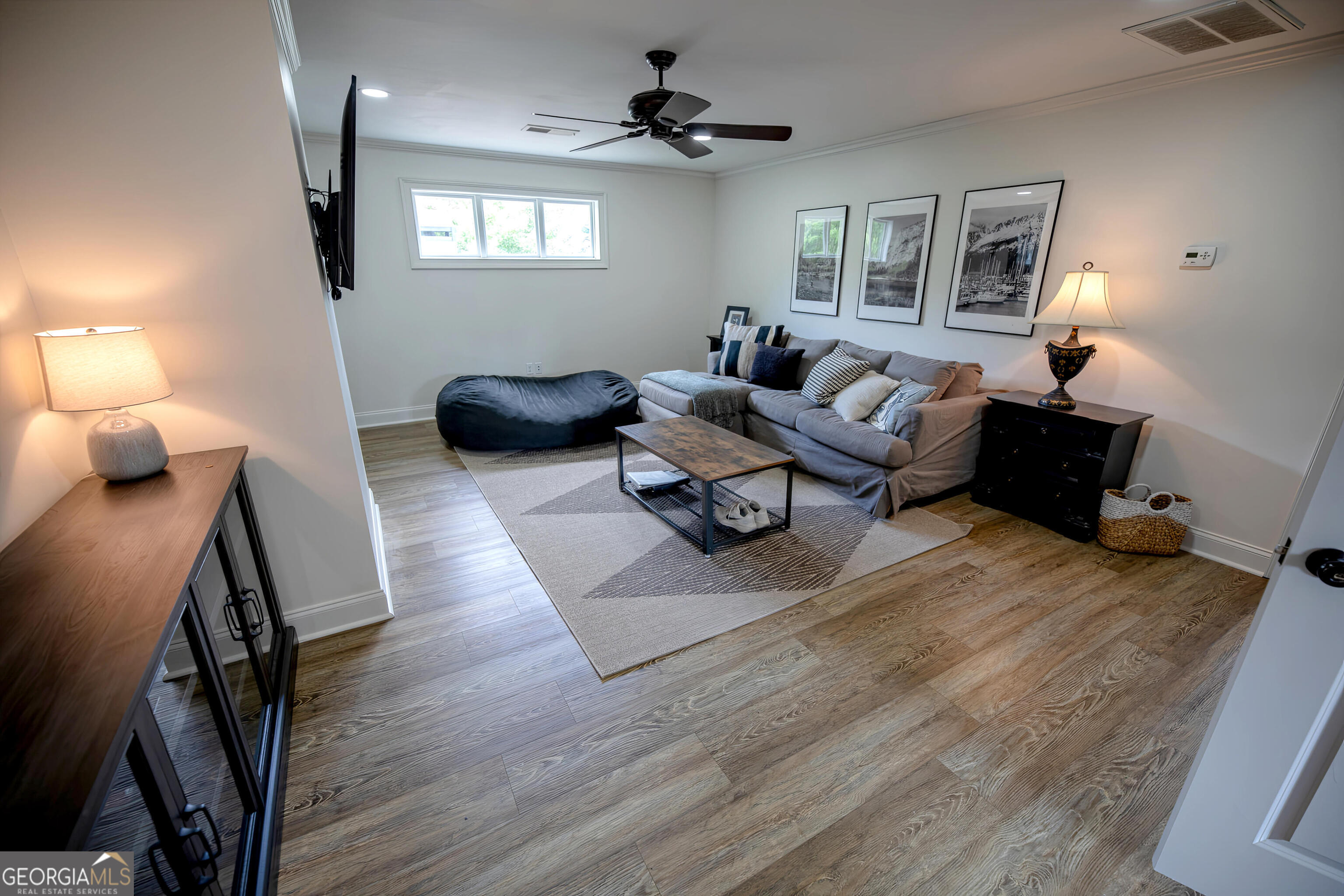 7093 Vaughn Road Woodstock, GA 30188 - Photo 20 of 41 a living room with furniture rug and window