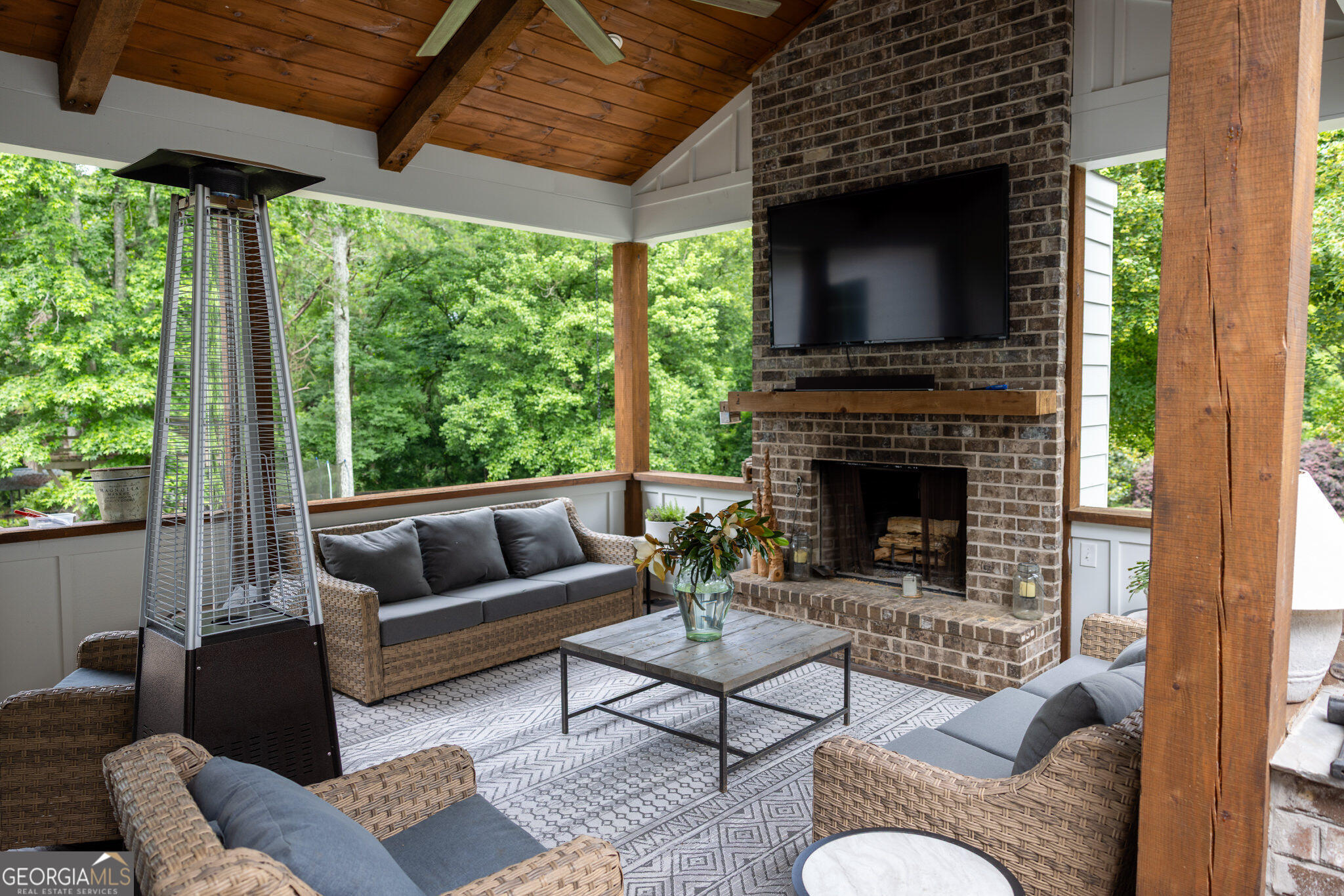 7093 Vaughn Road Woodstock, GA 30188 - Photo 28 of 41 a living room with furniture and a fireplace