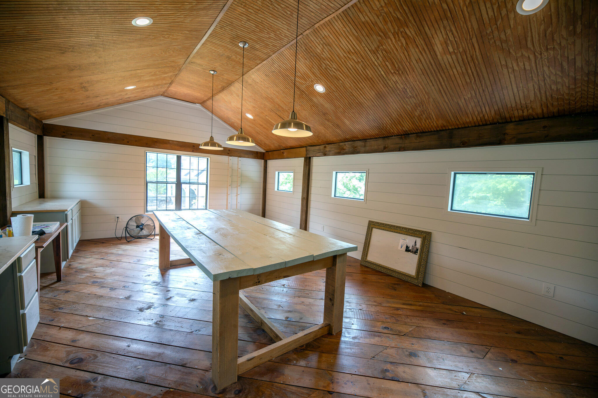 7093 Vaughn Road Woodstock, GA 30188 - Photo 31 of 41 a room with furniture and a wooden floor