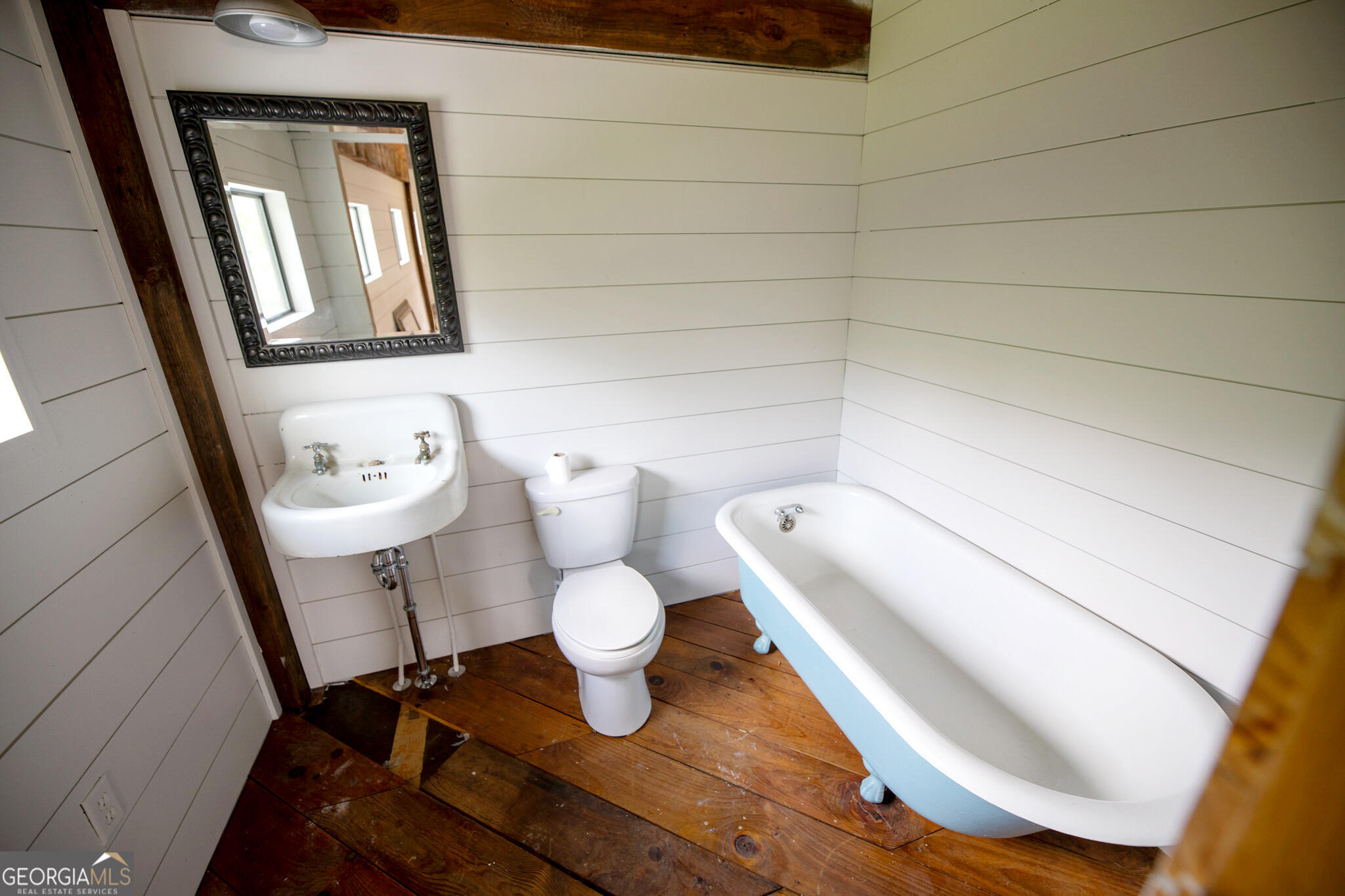 7093 Vaughn Road Woodstock, GA 30188 - Photo 32 of 41 a bathroom with a sink and toilet
