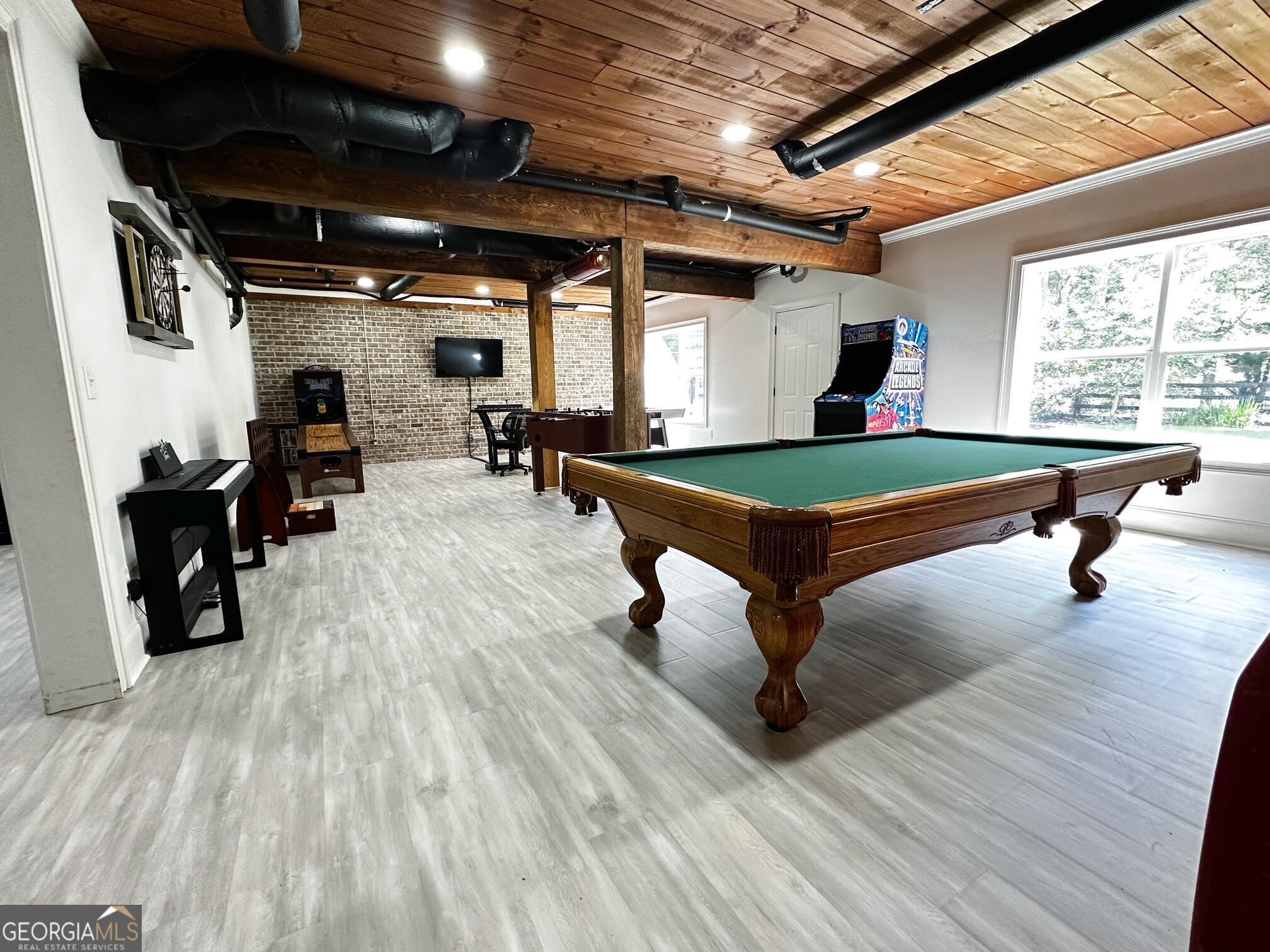 7093 Vaughn Road Woodstock, GA 30188 - Photo 34 of 41 a room with wooden floor and pool table