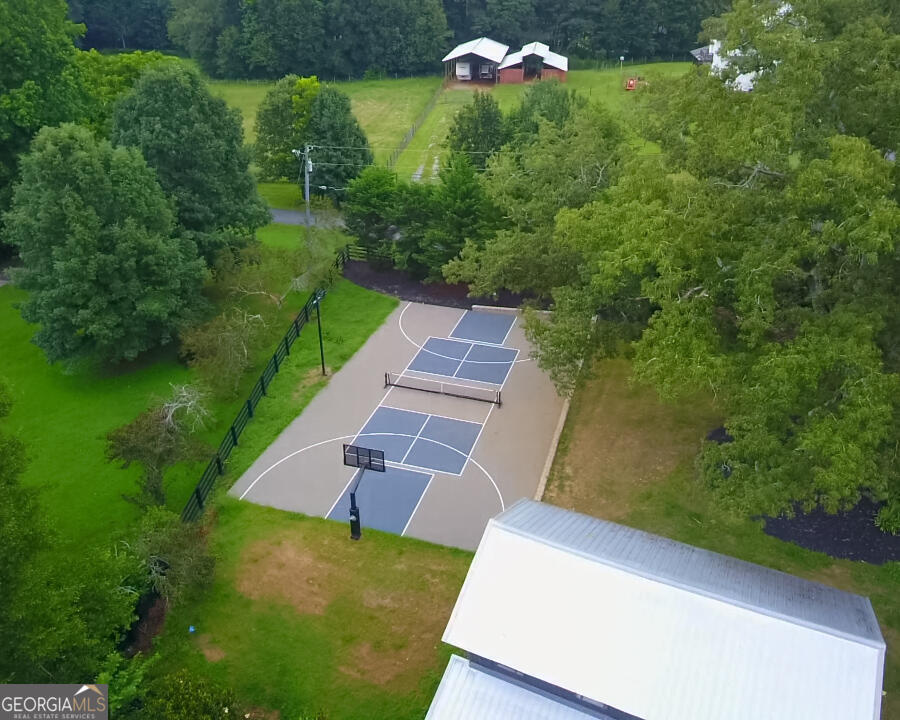 7093 Vaughn Road Woodstock, GA 30188 - Photo 41 of 41 an aerial view of a house with a yard