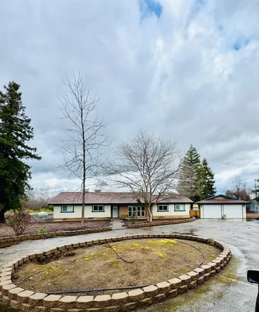 a view of a swimming pool with a yard