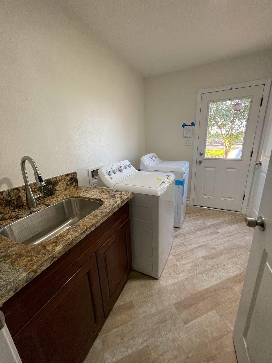 19342 East South Avenue Reedley, CA 93654 - Photo 18 of 29 a utility room with two sink and a washer dryer