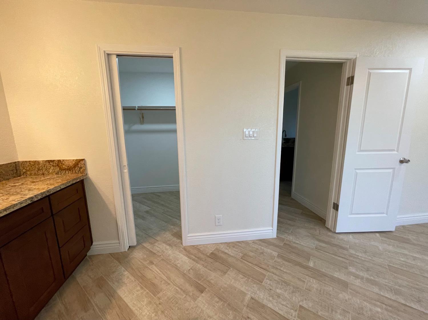 19342 East South Avenue Reedley, CA 93654 - Photo 24 of 29 an empty room with wooden floor and closet