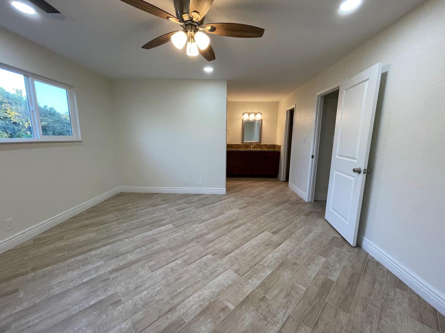 19342 East South Avenue Reedley, CA 93654 - Photo 28 of 29 wooden floor in an empty room with a window