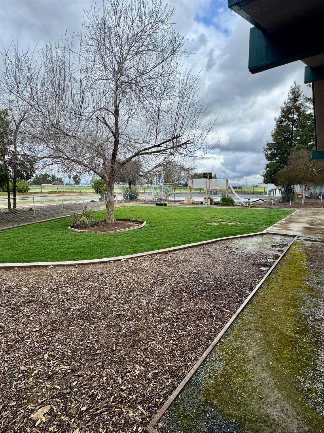 19342 East South Avenue Reedley, CA 93654 - Photo 30 of 36 a view of a garden and basketball court
