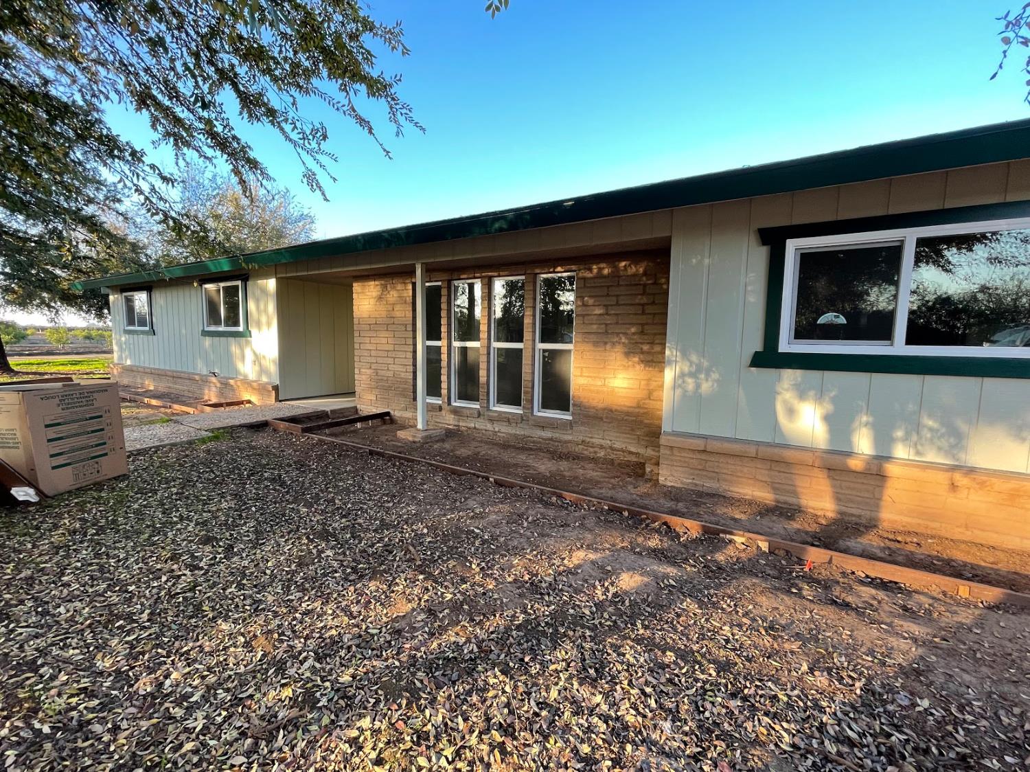 19342 East South Avenue Reedley, CA 93654 - Photo 5 of 29 a view of a house with backyard and swimming pool