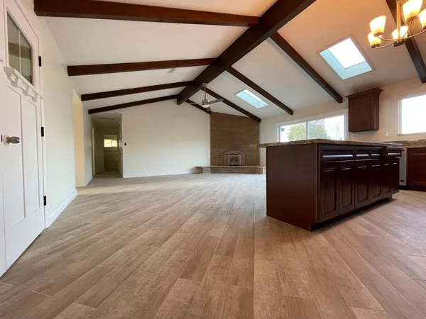 a kitchen with stainless steel appliances granite countertop a stove and a sink