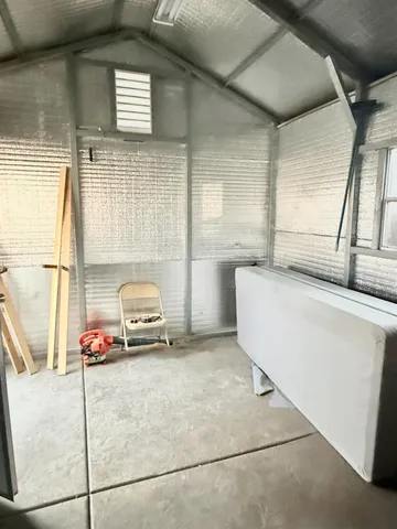 a kitchen with granite countertop stainless steel appliances wooden cabinets and a sink