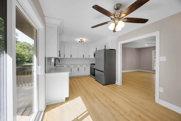 a view of a livingroom with furniture and wooden floor
