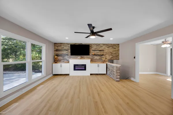 a view of a house with swimming pool and a yard