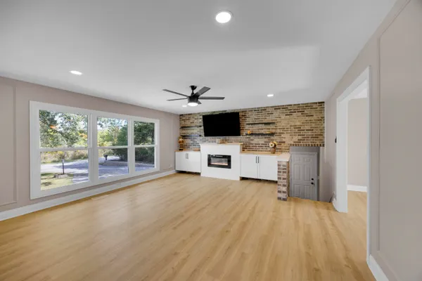 a front view of a house with a garden and plants