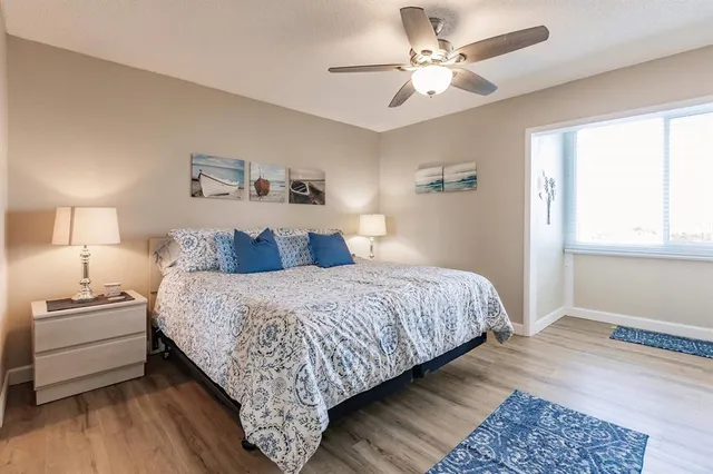 a bed room with a bed and a chandelier