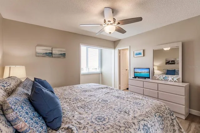 a bedroom with bed and window