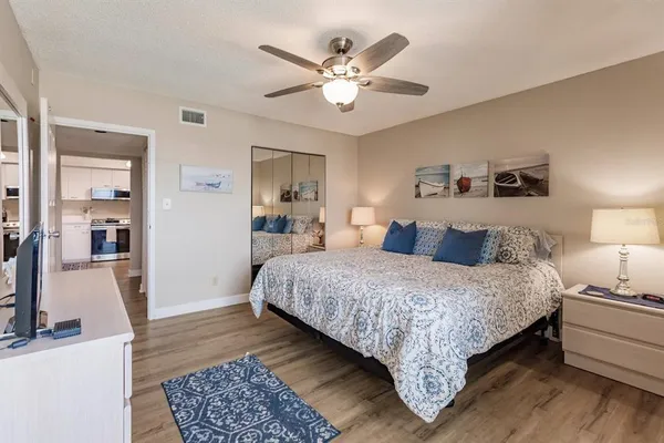 a bathroom with a granite countertop toilet sink and shower